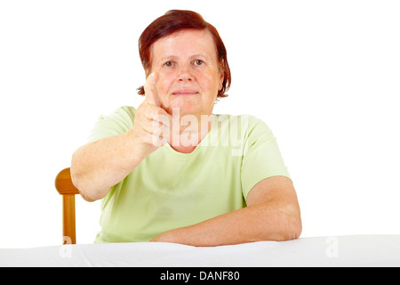 Senior donna rivolti a voi Foto Stock
