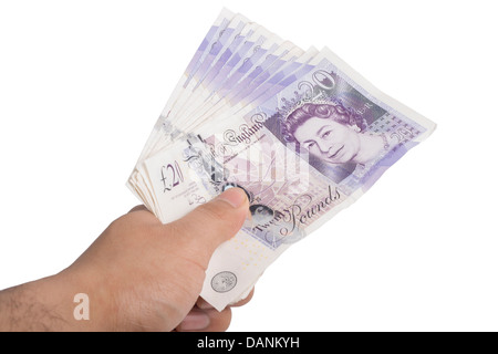 Uomo con British note (venti libbre), isolata su bianco Foto Stock