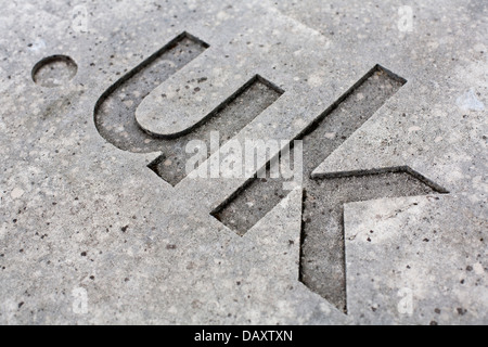 Close-up del '.uk " internet codice paese per il Regno Unito scolpita nella pietra. Foto Stock
