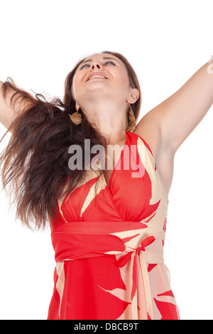 Ritratto di un sorridente giovane donna in abito rosso su sfondo bianco Foto Stock