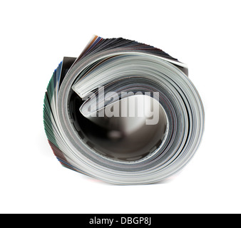 Rivista arrotolata su bianco Foto Stock