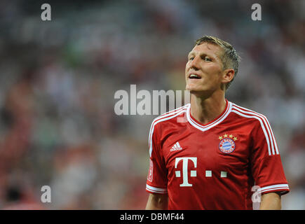 Monaco di Baviera, Germania. 01 Ago, 2013. Monaco di Baviera Bastian SCHWEINSTEIGER reagisce durante l'Audi Cup Soccer match finale FC Bayern Monaco vs Manchester City FC a stadio Allianz Arena di Monaco di Baviera, Germania, 01 agosto 2013. Foto: Andreas Gebert/dpa/Alamy Live News Foto Stock