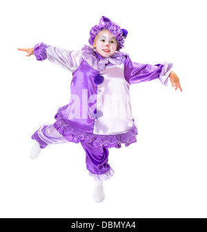 Adorabile ragazza danzante in costume da clown in posa come una marionetta senza corde Foto Stock