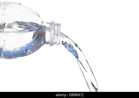 Water pouring out of plastic bottle isolated on White Foto Stock