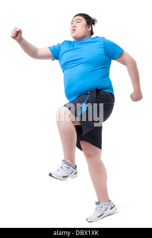 Il sovrappeso uomo correre con difficoltà Foto Stock