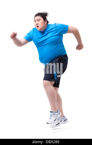 Il sovrappeso uomo correre con difficoltà Foto Stock