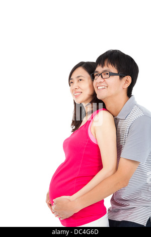 Felice la donna incinta e il marito isolato su bianco Foto Stock