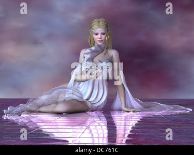 Una bella fata trattiene il suo piccolo drago pet nella sua mano. Foto Stock