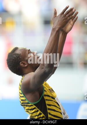 Usain Bolt della Giamaica reagisce dopo gli uomini 4x100m relè finale al quattordicesimo IAAF ai Campionati Mondiali di atletica di Luzhniki Stadium di Mosca, Russia, 18 agosto 2013. Foto: Bernd Thissen/dpa Foto Stock