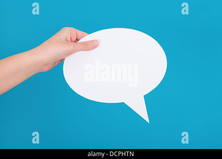 Mano che tiene un vuoto discorso bolla Foto Stock