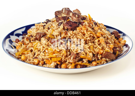 Uzbek piatto nazionale pilaf su piastra Foto Stock
