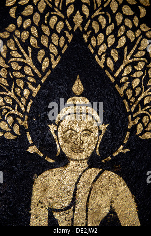 Il Buddismo Theravada, oro antico dipinto murale di Buddha, meditazione, nel tempio di Wat Xieng Thong, Luang Prabang provincia, Laos Foto Stock