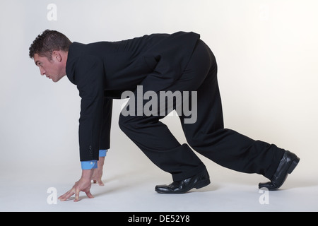 Business man sul blocco di partenza Foto Stock