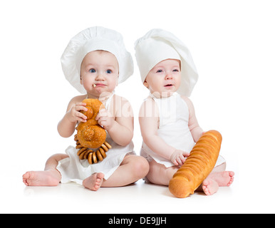 Funny bakers bebè un ragazzo e una ragazza Foto Stock