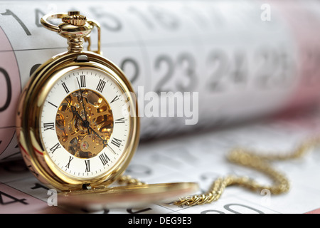 Oro orologio da tasca e calendario Foto Stock