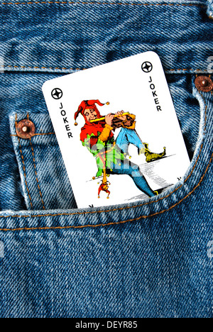 Joker, carta da gioco, tasca dei jeans Foto Stock