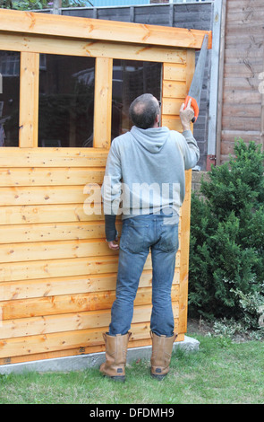 La costruzione di una tettoia in legno Foto Stock