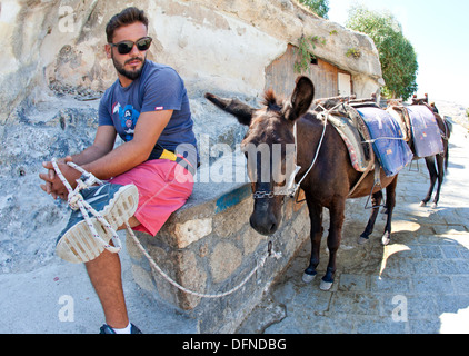 Uomo di asino in appoggio Lindos Grecia Foto Stock