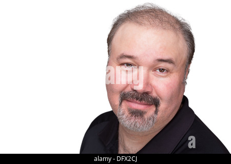 Uomo di mezza età con il suo pizzetto guardando fiduciosamente la fotocamera e soddisfatto Foto Stock