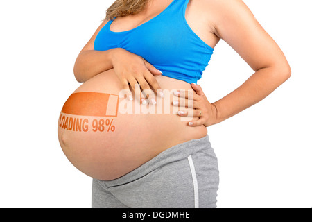 Donna incinta pancia isolato in bianco Foto Stock