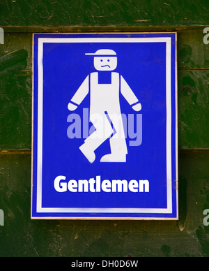 Un divertente gents wc segno. Foto Stock