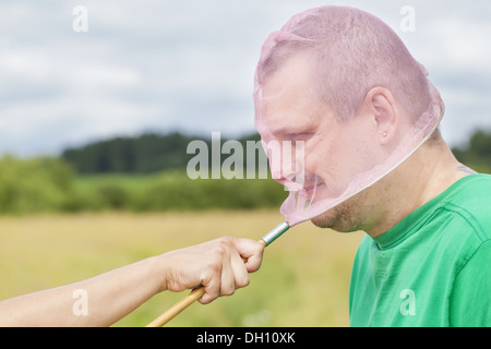 Catturate l'uomo con una farfalla net Foto Stock