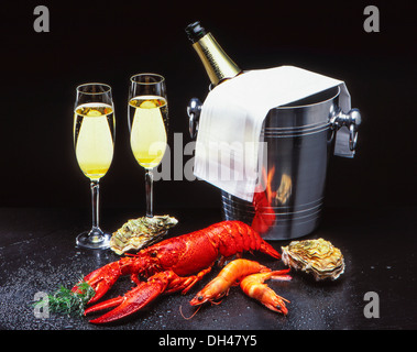 Frutti di mare con champagne Foto Stock