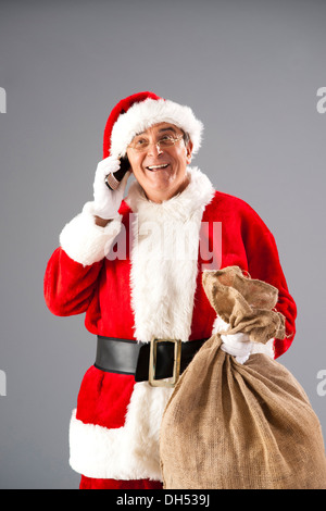 Babbo Natale sul telefono Foto Stock