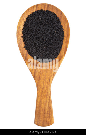 Il cumino nero o kalonji (semi di nigella sativa) nel cucchiaio di legno su sfondo bianco Foto Stock