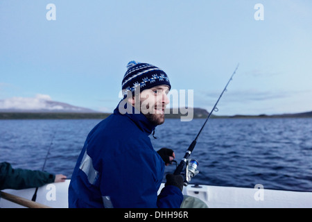 Gli uomini sul viaggio di pesca Foto Stock