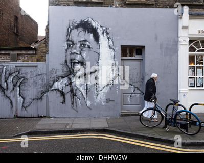 Arte di strada da Guy Denning in Hanbury Street, Off Brick Lane, Londra Foto Stock