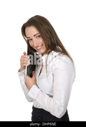 Imprenditrice abbracciando tavoletta digitale Foto Stock