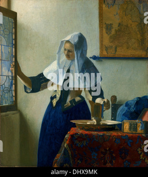 Giovane donna con una brocca di acqua - da Johannes Vermeer, 1662. Foto Stock