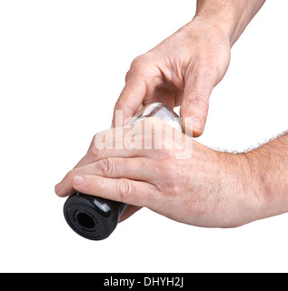 Usando un agitatore di sale o pepe-mill Foto Stock