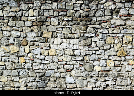 Un enorme muro di pietra sfondo texture Foto Stock