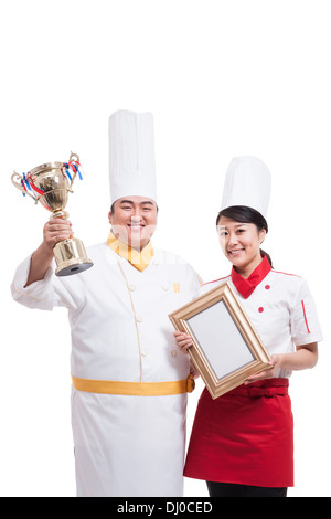 Cuochi con trofeo e certificato Foto Stock