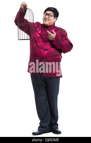 Felice giovane nel codolo tuta con una birdcage Foto Stock