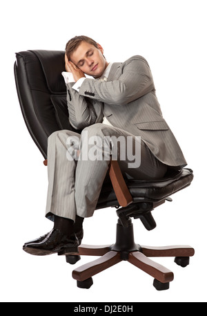 Bel giovane uomo dorme in poltrona Foto Stock