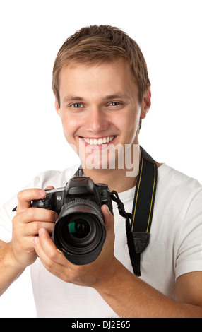 Ritratto di un bel giovane azienda una fotocamera Foto Stock