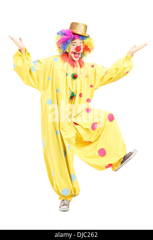 A piena lunghezza Ritratto di un maschio funny circus clown in posa Foto Stock