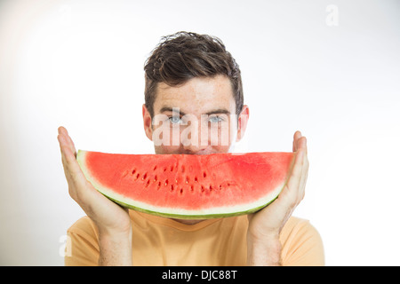 Uomo con cocomero Foto Stock