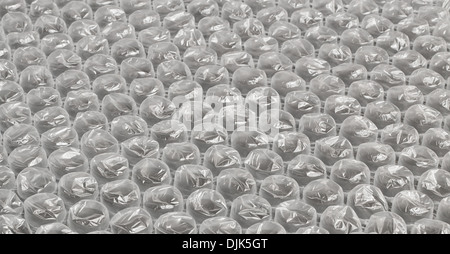 La bolla di plastica avvolgere lo sfondo spesso utilizzato nel confezionamento di oggetti fragili per la consegna nel post Foto Stock