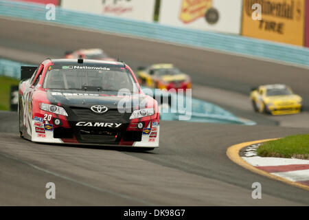 Agosto 13, 2011 - Watkins Glen, New York, Stati Uniti - NASCAR Nationwide conducente Joey Logano in #20 auto al terzo posto nella gara della mostra Zippo 200 al Glen (credito Immagine: © Mark Konezny/Southcreek globale/ZUMAPRESS.com) Foto Stock