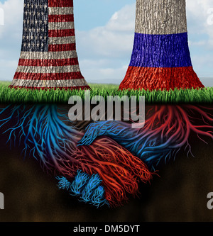 USA Russia la cooperazione e il partenariato attività diplomatica e concetto di lavorare insieme per gli interessi comuni come due alberi crescenti con le bandiere dipinte su con radici metropolitana conformato come agitando mani umane in accordo. Foto Stock