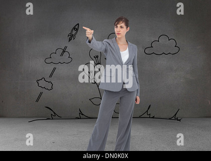 Immagine composita della giovane imprenditrice che punta a qualcosa Foto Stock