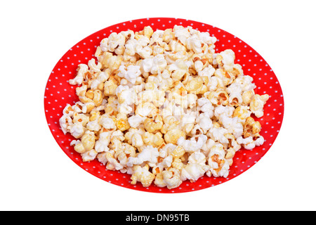 Il Popcorn su una piastra isolata su sfondo bianco Foto Stock