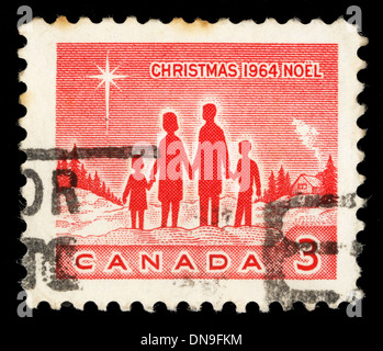 CANADA - circa 1964: un timbro di Natale stampato in Canada mostra famiglia e la Stella di Betlemme, circa 1964 Foto Stock