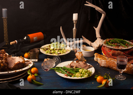 Arrosto di maiale dopo cena math still life Foto Stock