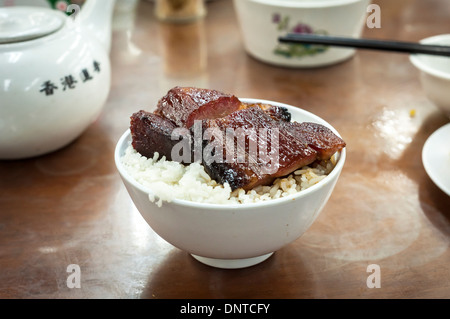 Hong kong-style maiale grigliato servito presso un locale dim sum ristorante Foto Stock