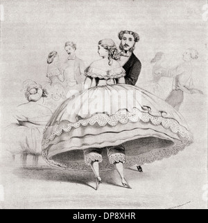 Xix secolo lady indossa una crinolina ad una sfera. Foto Stock
